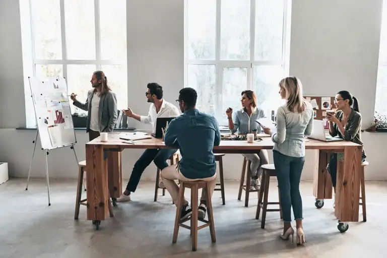 Team collaborating in a modern office meeting.