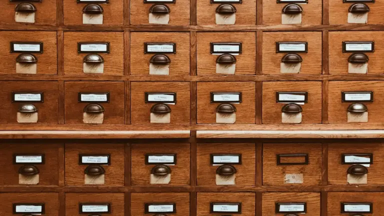 Wooden library card catalogue drawers.