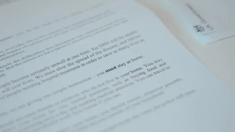 Close-up of government document stating 'must stay at home'.