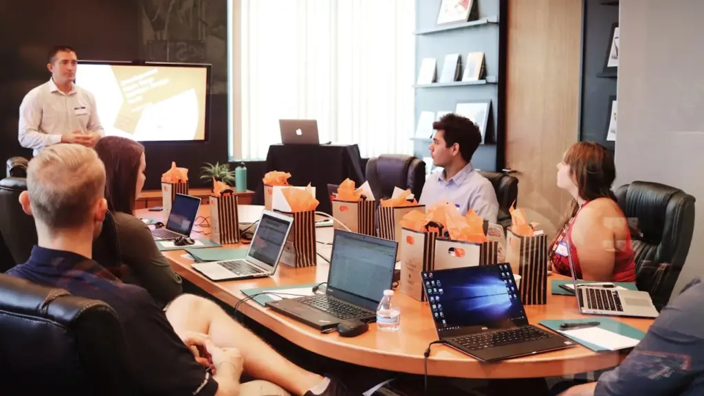 Team meeting with presentation in modern boardroom