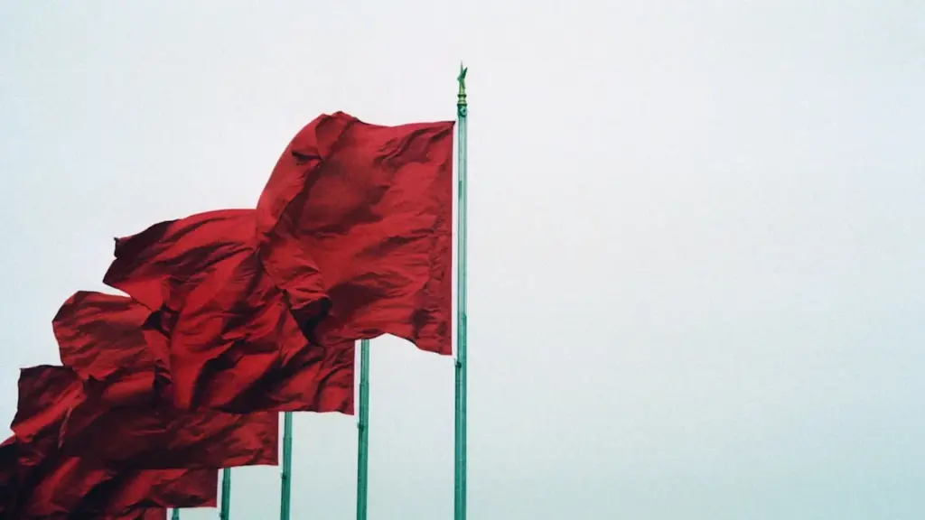 Red flags flying in strong wind